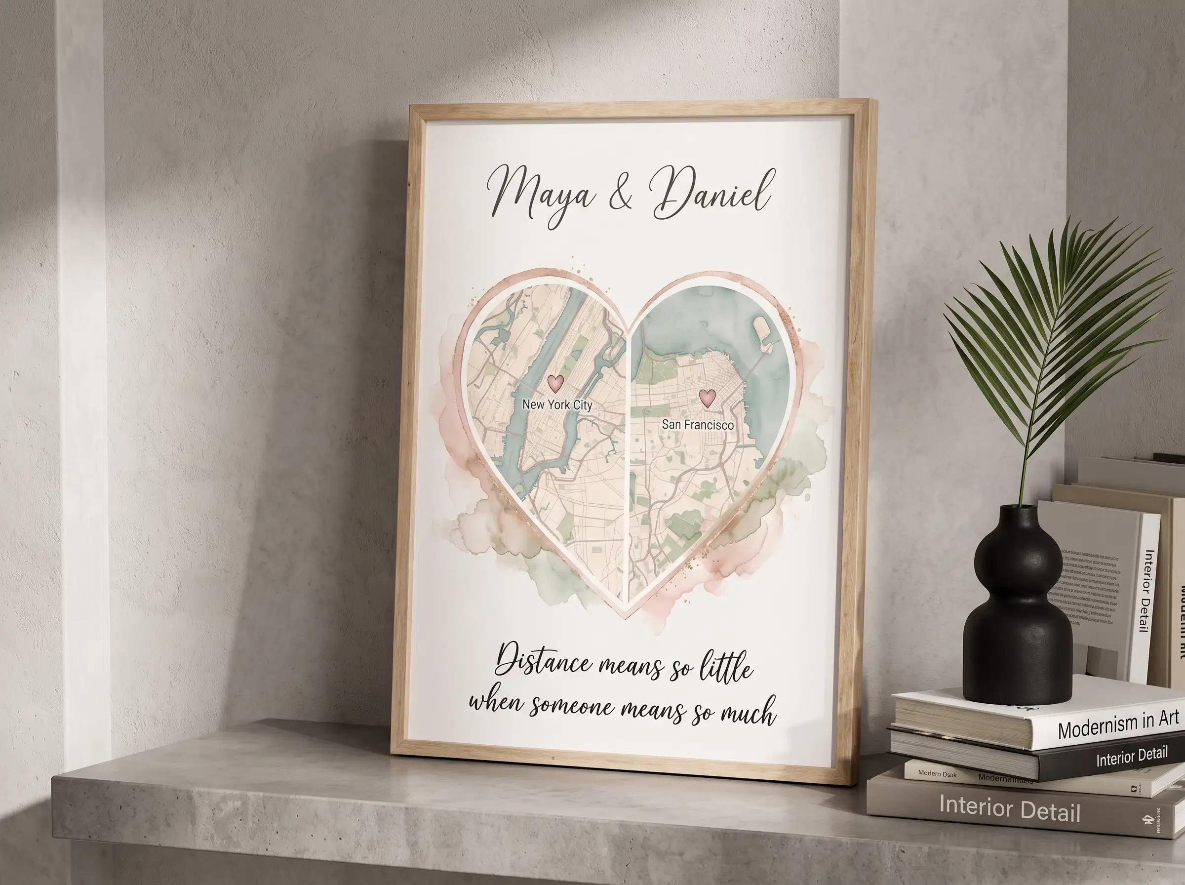 Hands holding a custom framed two city map print featuring two partner locations connected across distance